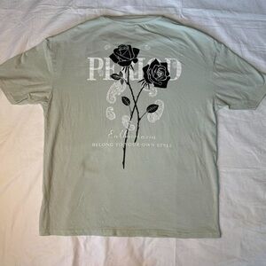 Light green graphic tee with black rose design